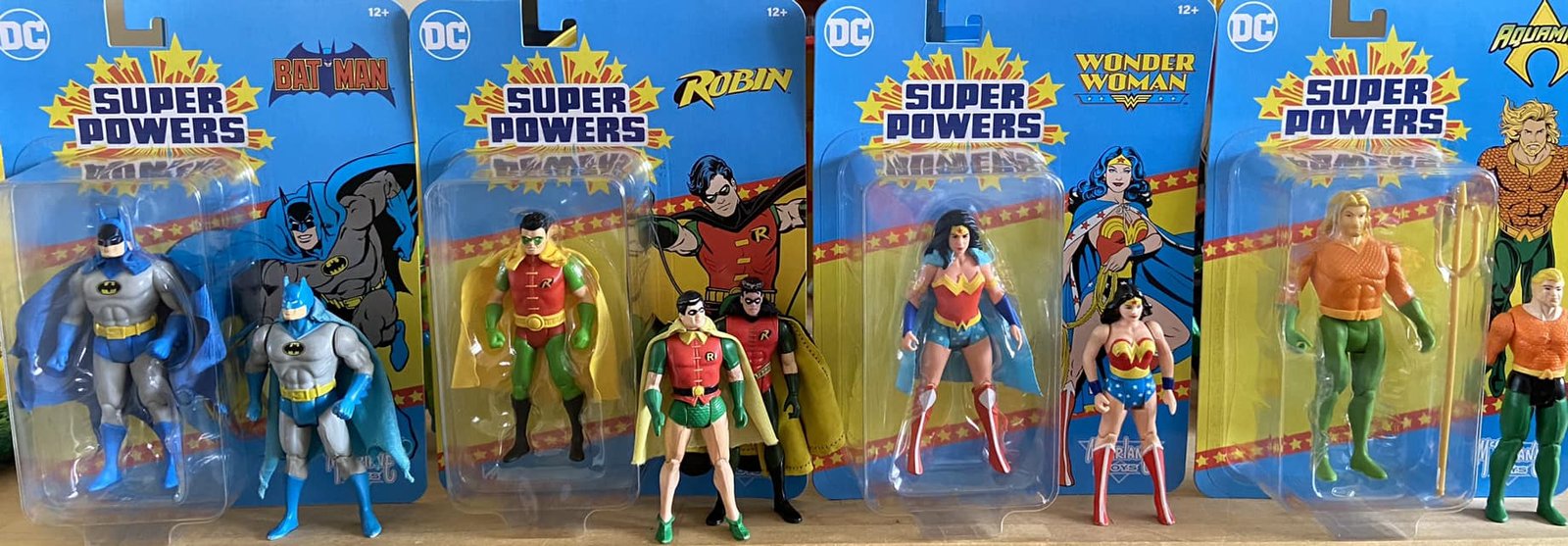 vintage comparison DC Super Powers Wave 4 in hand cardbacks front