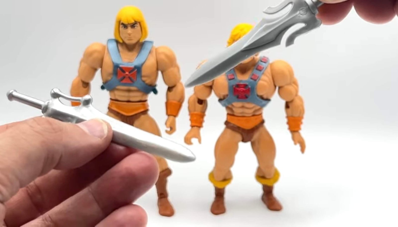 He-Man-Cartoon-Collection-comparison-Origins-He-Man swords