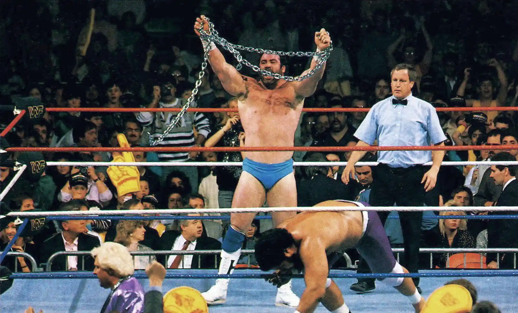 hercules hernandez with chains and light blue trunks