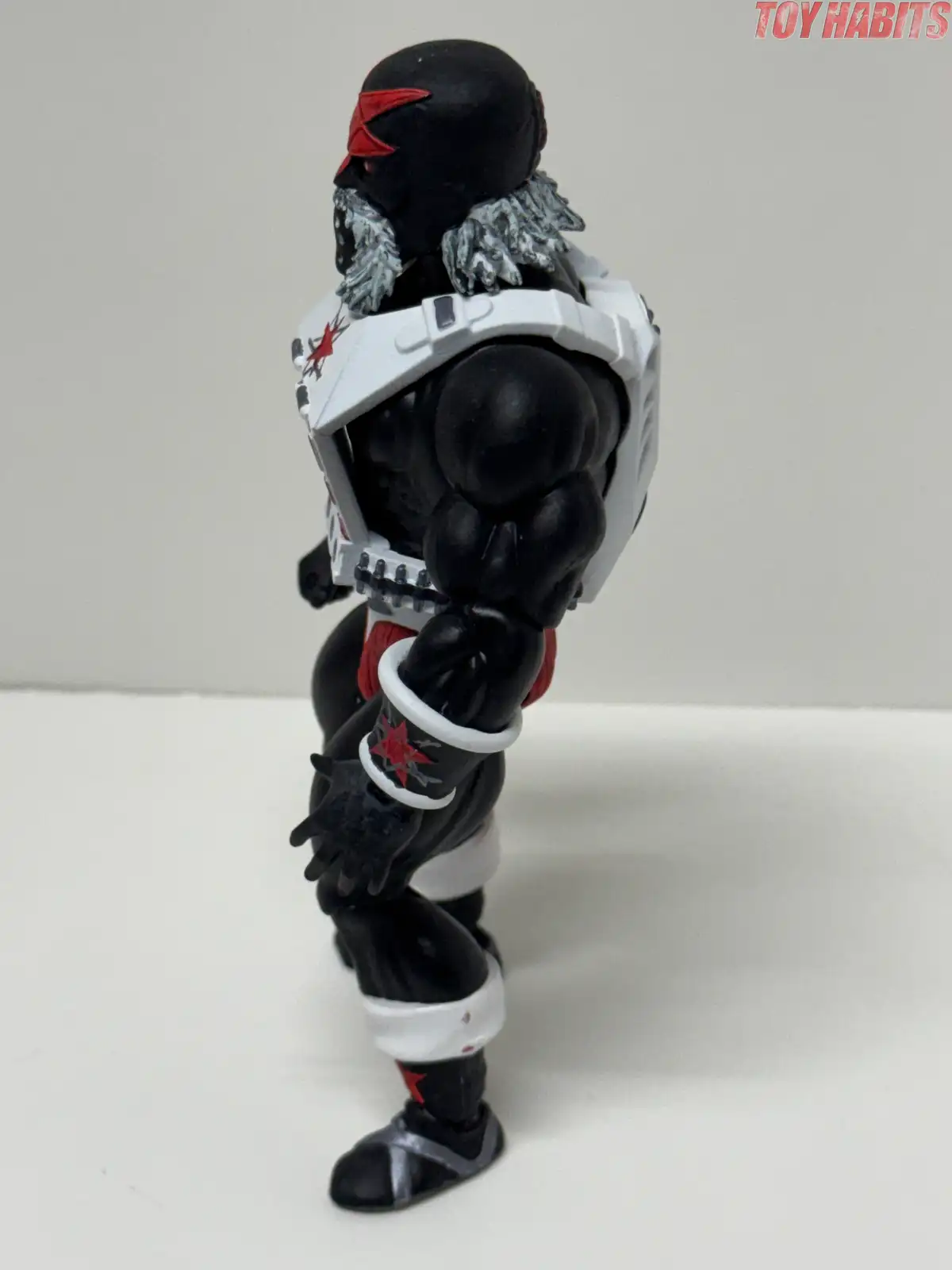 The opposite profile highlights how the white armor extends over the shoulders and continues around the back.