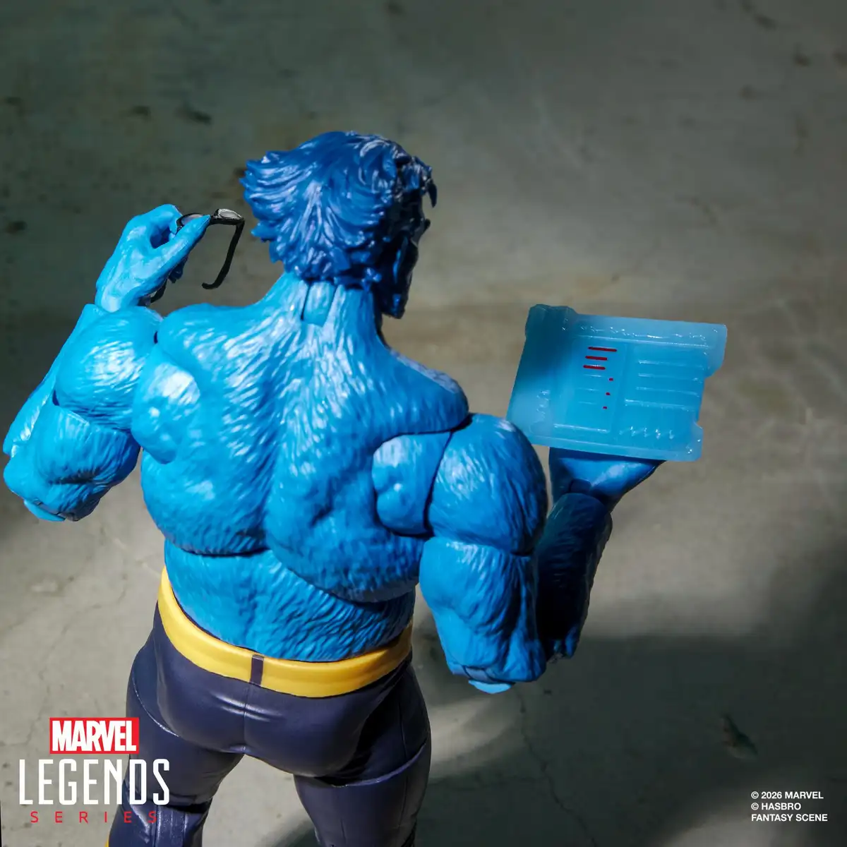 Rear view of Beast showing the fur detailing across his back, removable glasses, and translucent blue display accessory.