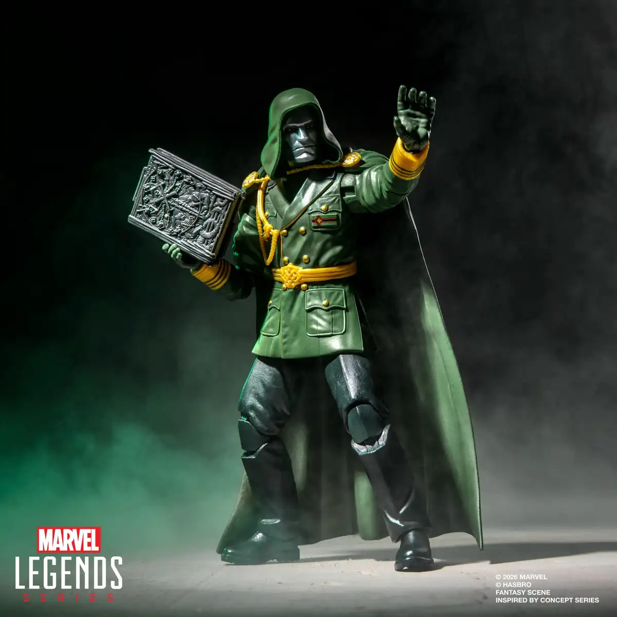 Lord Doom holds the closed book in one hand while extending his opposite hand, showing the gold trim on his green uniform.