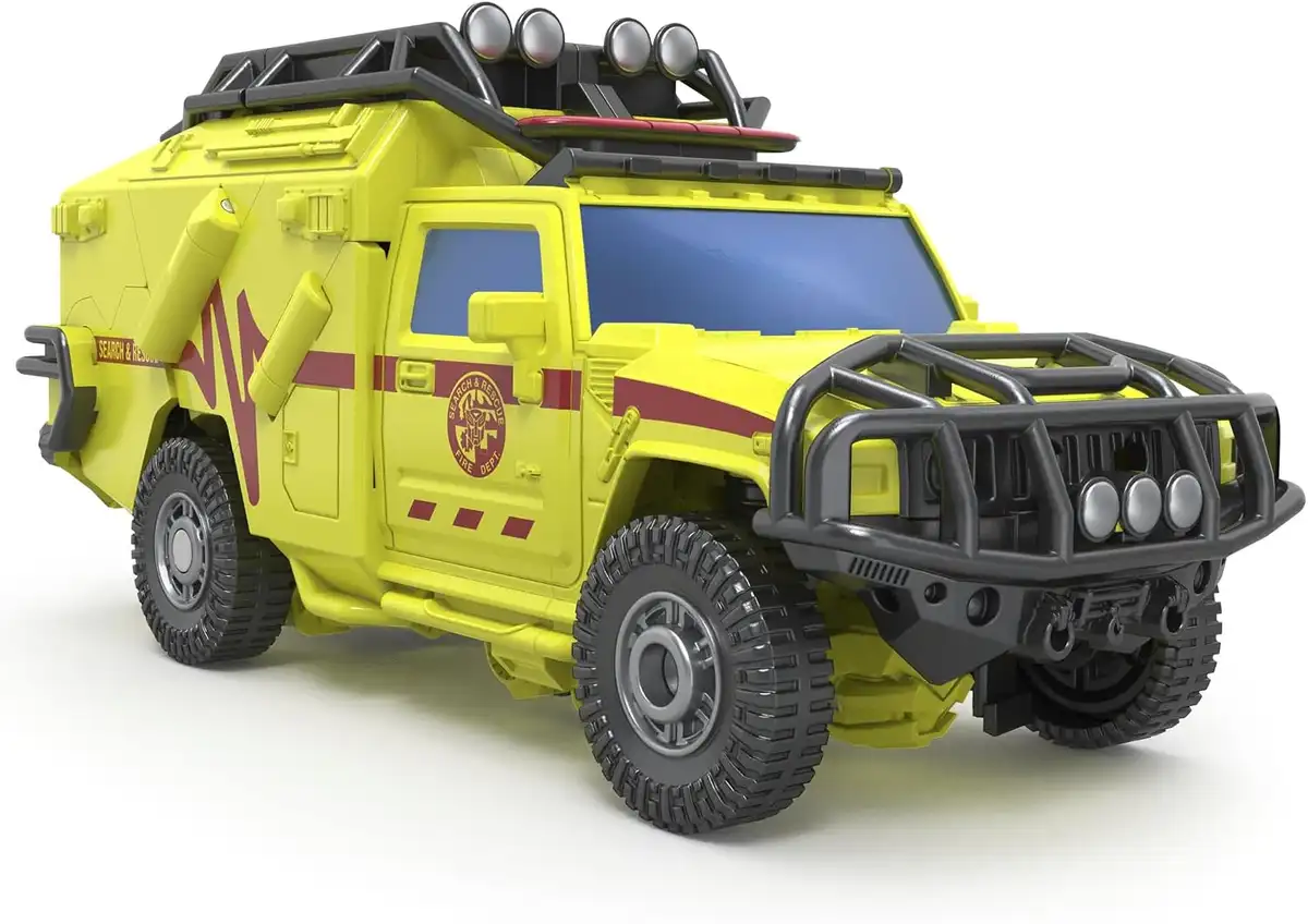 Ratchet transforms into a yellow-green rescue SUV with black grille protection, roof-mounted lights, dark windows, and rescue markings along the doors.