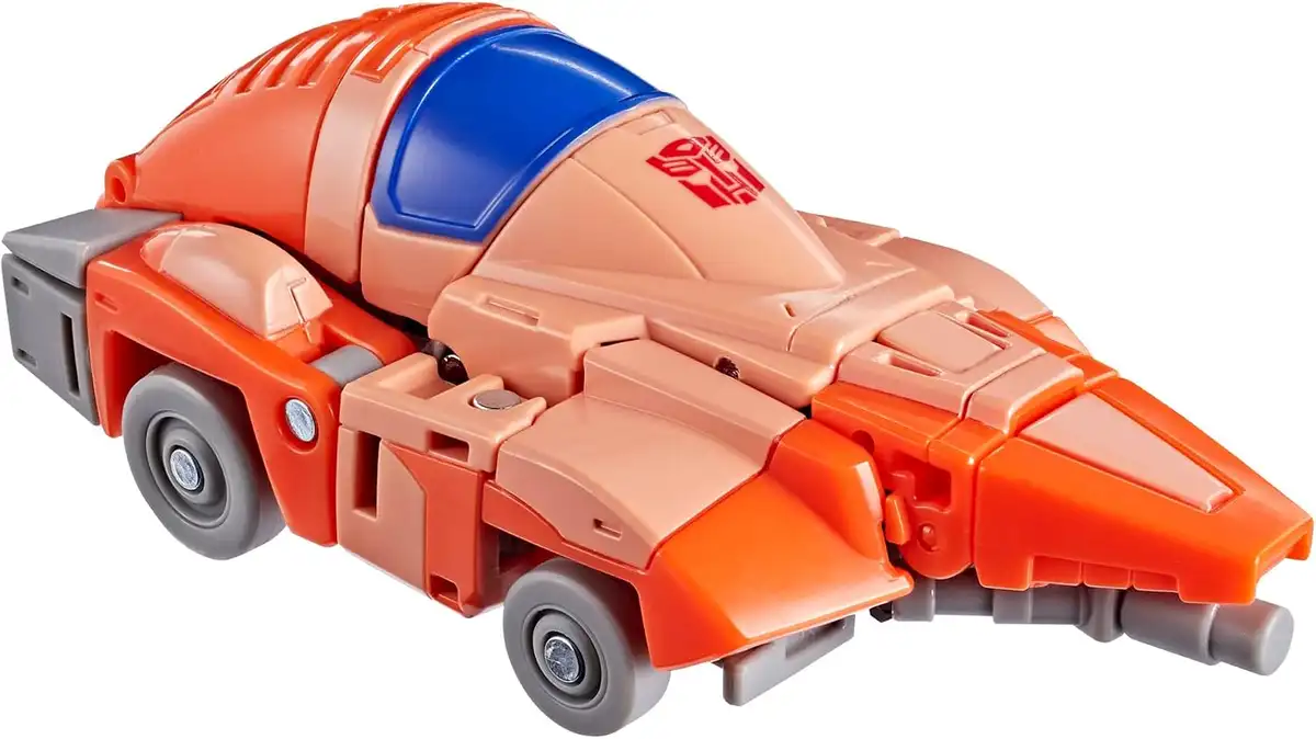 Wheelie’s futuristic orange vehicle mode has a rounded blue canopy, gray wheels, and a pointed front end.